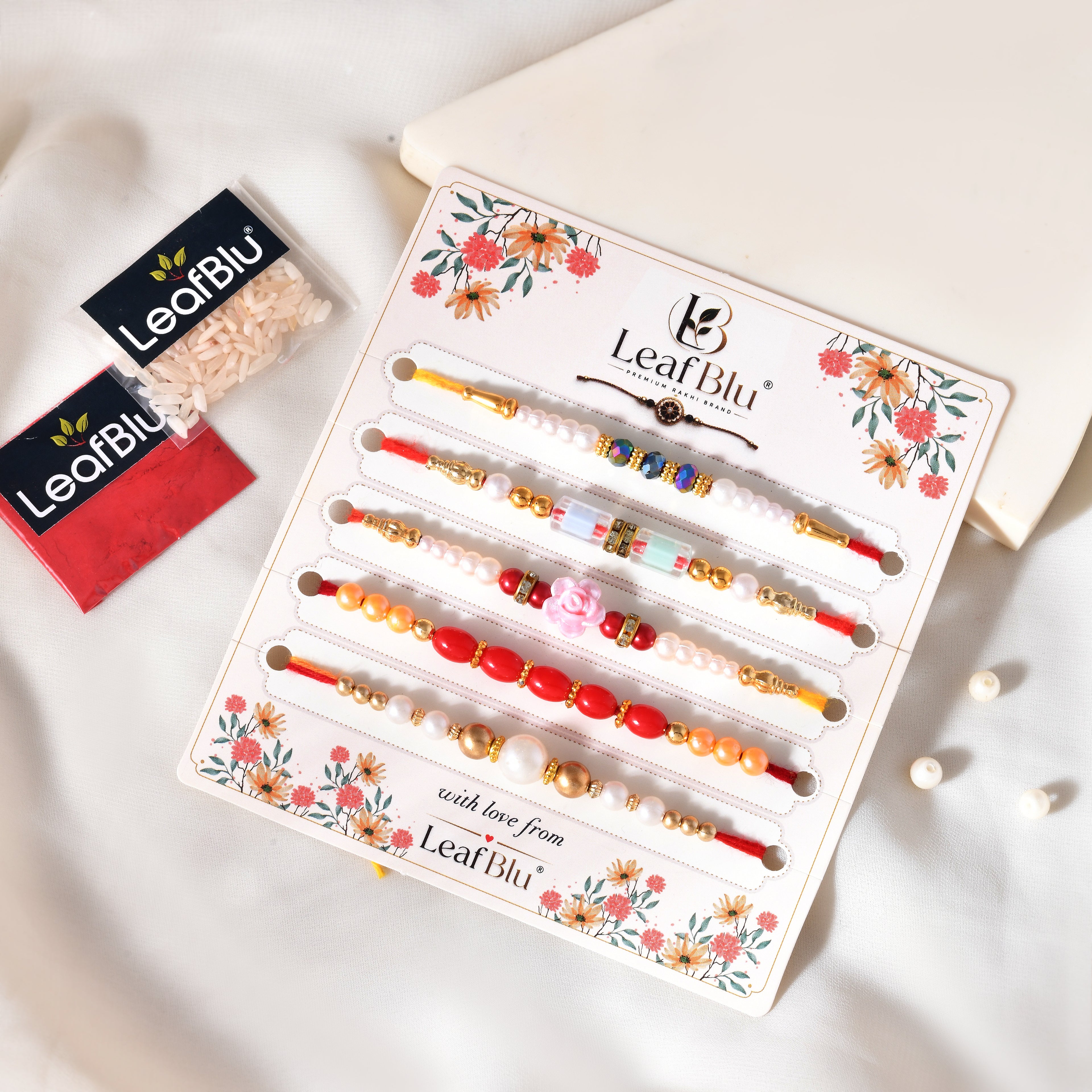 LeafBlu Designer Pearl Rakhi Set of 5 with Rakhi Agreement Card, Greeting Card & Roli Chawal | Raksha Bandhan Gift Combo