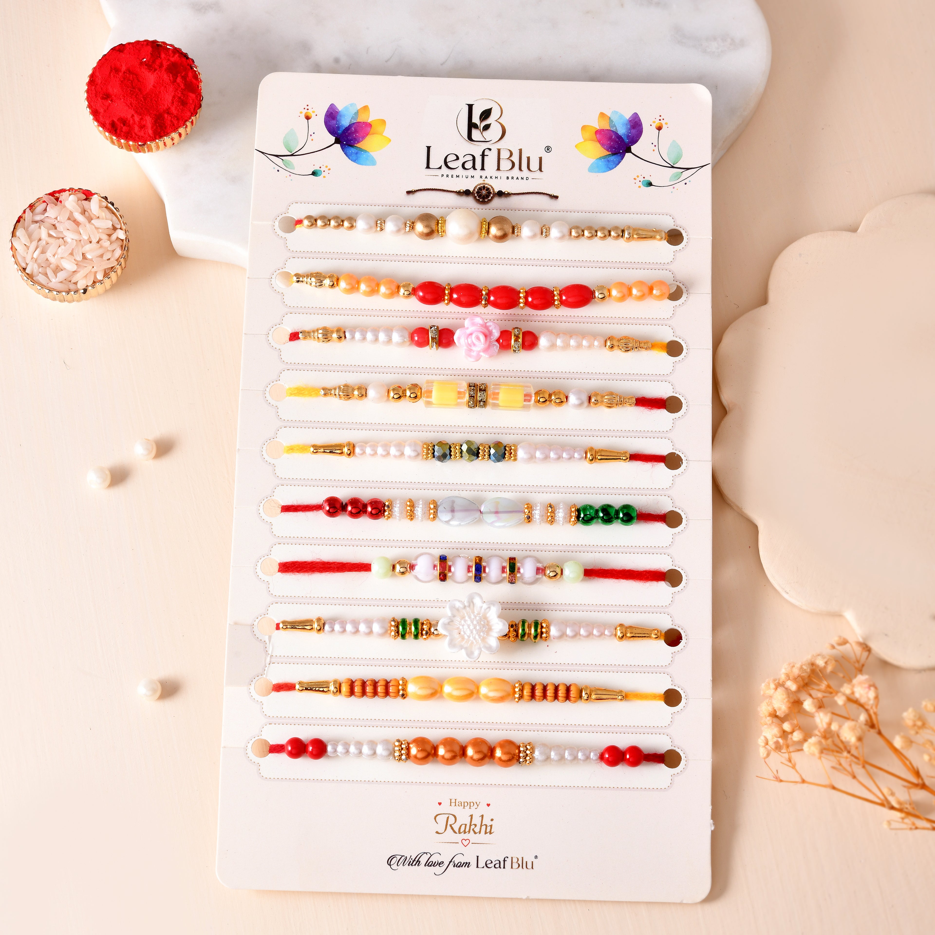 LeafBlu Premium Designer Rakhi Set of 10 for Brother with Rakhi Agreement Card, Greeting Card & Thali Roli Chawal | Handmade Pearl & Beaded Raksha Bandhan Gift Combo